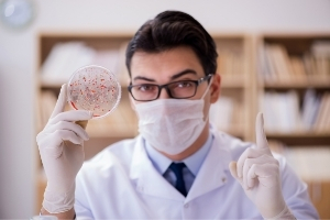 Scientist Holding Up Petri Dish